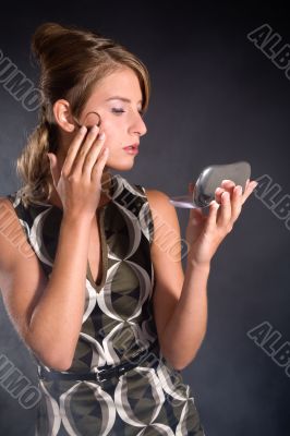 Checking her makeup