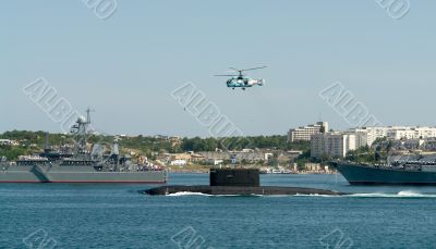 helicopter over a submarine