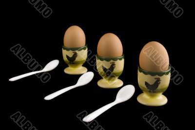 egg-cups with eggs to eat