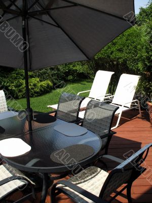 Suburban home backyard with patio furniture