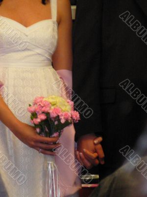 Bride And Groom Hold Hands