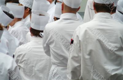 Group Of Chefs Standing In Uniform Whites