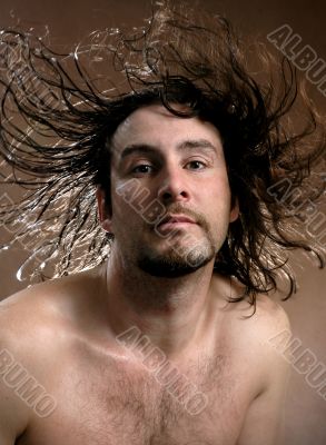 Portrait of the man with flying hair