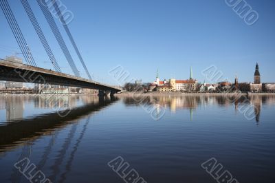 Old Town Panorama with River and Bridge Fragment in Sunny Day