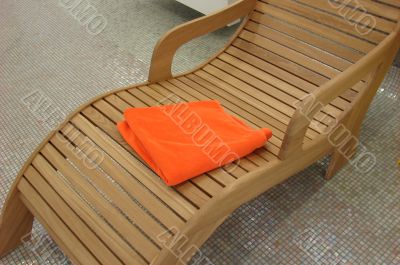relax chair with orange towel