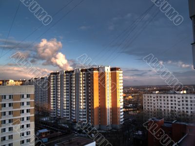 Kind from a window on evening city