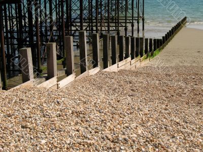 Groynes between pier and pebbly beach