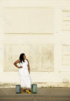 African American woman with suitcases