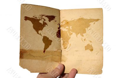 hand holding aged world map