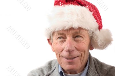 Smiling older man with santa hat Smiling older man with santa hat