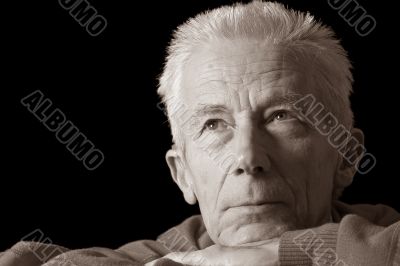 Serious older man in sepia Serious older man in sepia