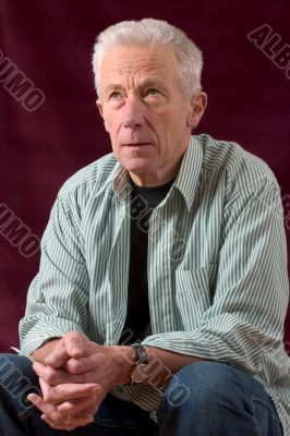 Senior man sitting in relaxed pose