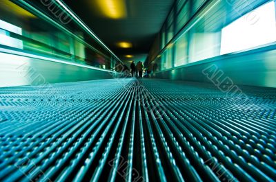 traveling on a moving escalator