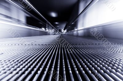 traveling on a moving escalator