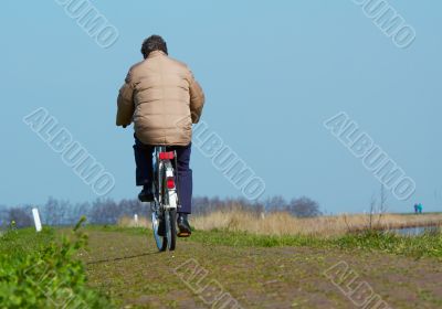 man on bicycle in spring man on bicycle in spring