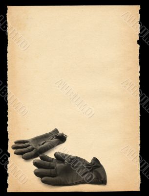 torn out old sheet of paper with gloves motif