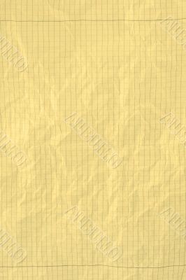 yellow crumpled squared piece of paper