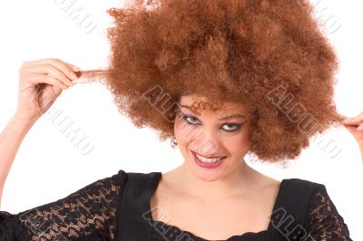 Teenage beauty having wig-fun