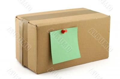 cardboard box with pinned note