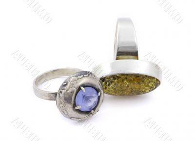 two aged rings with gems on white