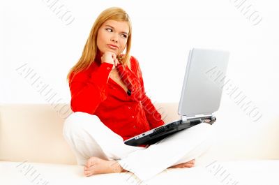 Women with laptop on couch