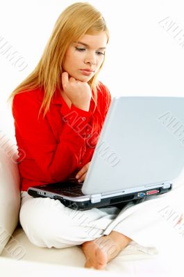 Women with laptop on couch