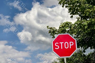 stop sign against cloudy sky
