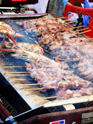 Barbecued prawns and kebabs at festival