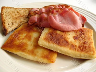 Scottish breakfast of potato scones and bacon
