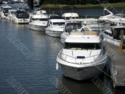 Boats moored at river side jetty