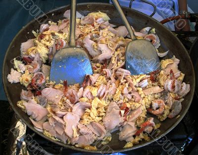 Wok with meat eggs and fish