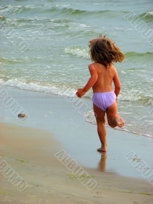 girl running on the beach