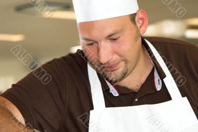 Italian chef working concentrated