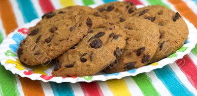 Chocolate chip cookies on colourful background