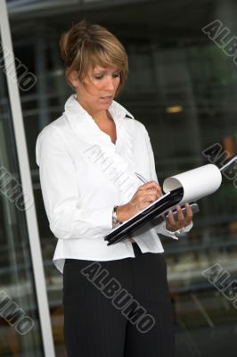 Businesswoman taking notes