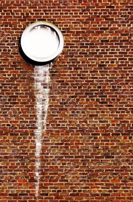 Wall with porthole and optical illusion