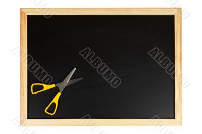 Chalkboard with yellow scissors