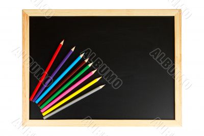 Chalkboard and multicolored pencils