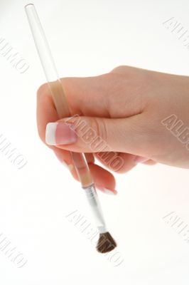 female hand with paintbrush