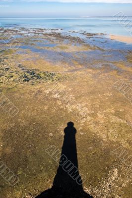 lighthouse shadow in landscape