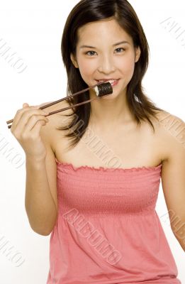 Girl Eating Sushi Roll