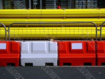 Yellow pipes and road barriers