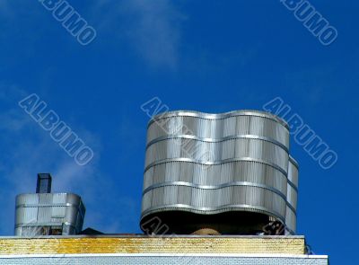 Water Tower Over Urban Skyline