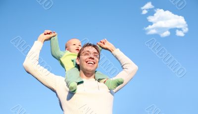 Father with son on shoulders