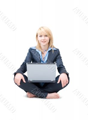 Shoeless businesswoman with laptop do meditative exercises