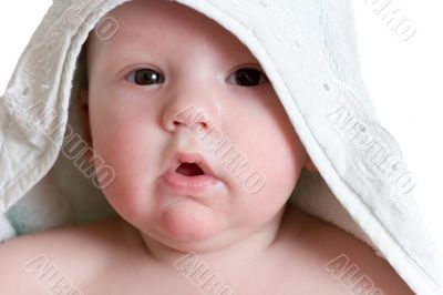 Little baby under white towel