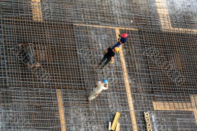 Workers on steel bars