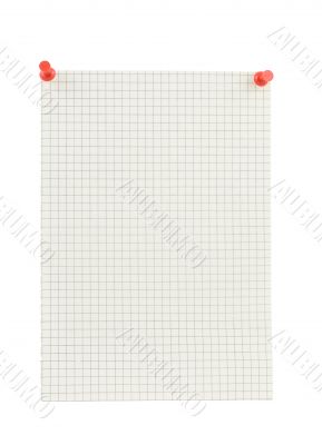 piece of squared paper thumbthacked to white wall