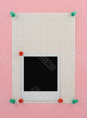 photo pinned to a piece of squared paper