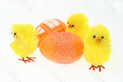 three toy chickens with decorated eggs